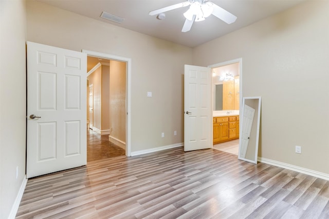 unfurnished bedroom featuring ceiling fan, light hardwood / wood-style floors, and ensuite bath