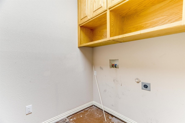 washroom with hookup for a washing machine, cabinets, and hookup for an electric dryer