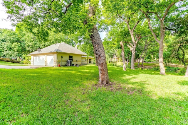 view of yard featuring a garage