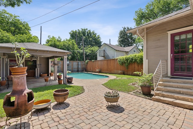 view of swimming pool featuring a patio area