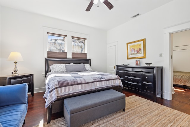 bedroom with ceiling fan and dark hardwood / wood-style floors