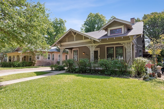 craftsman-style home featuring a front yard and a porch