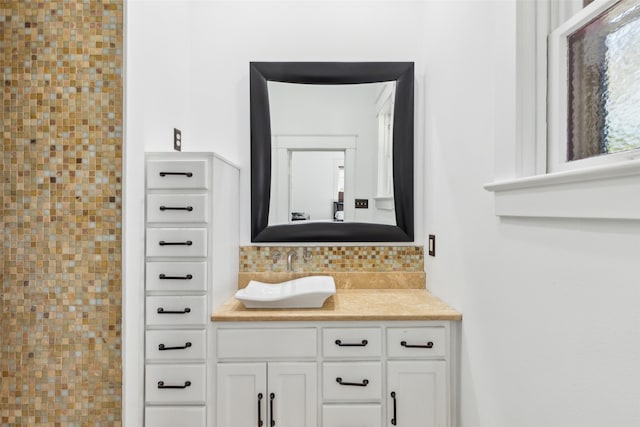 bathroom with vanity and backsplash