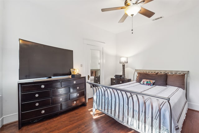 bedroom featuring dark hardwood / wood-style flooring and ceiling fan