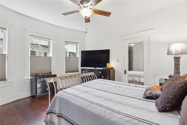 bedroom featuring ceiling fan and dark hardwood / wood-style floors