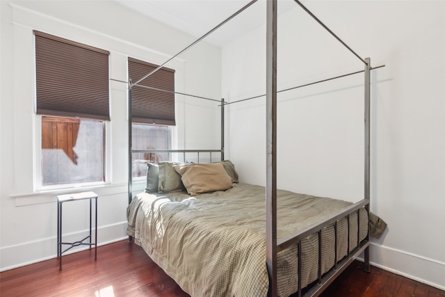 bedroom featuring dark hardwood / wood-style flooring