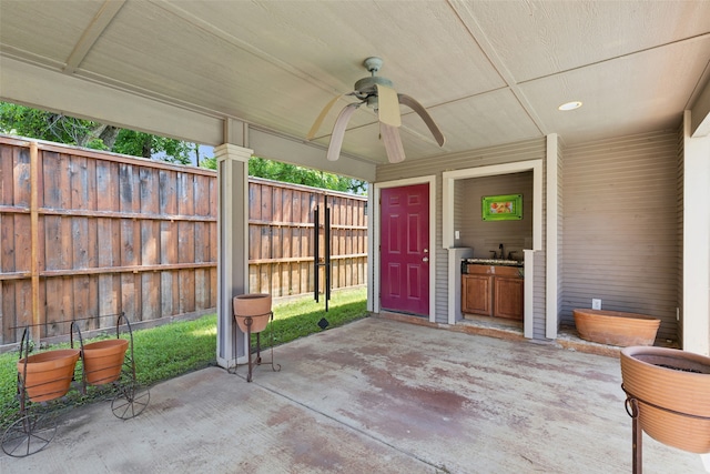 view of patio / terrace with ceiling fan and sink