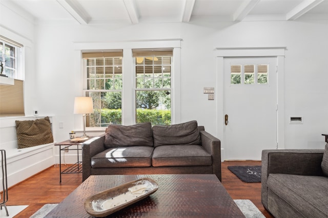 living room with beamed ceiling and hardwood / wood-style flooring