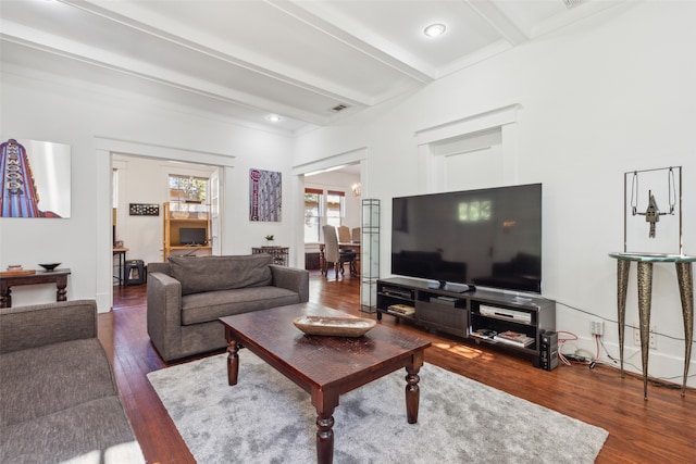 living room with beam ceiling and dark hardwood / wood-style floors