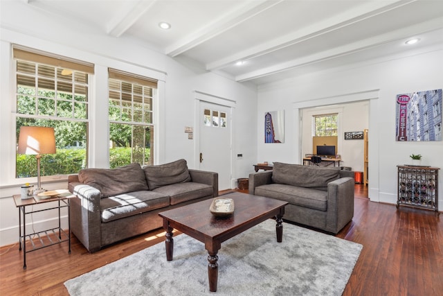 living room with dark hardwood / wood-style floors and beam ceiling