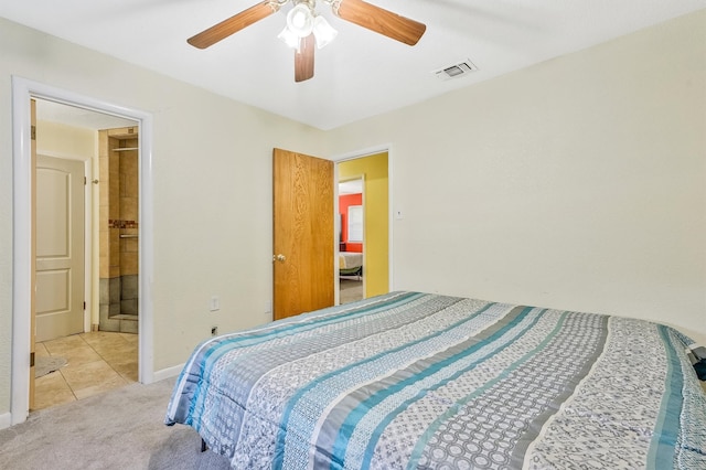 carpeted bedroom featuring ensuite bath and ceiling fan