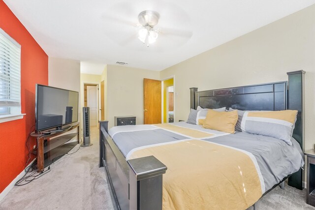 bedroom featuring ceiling fan and light carpet