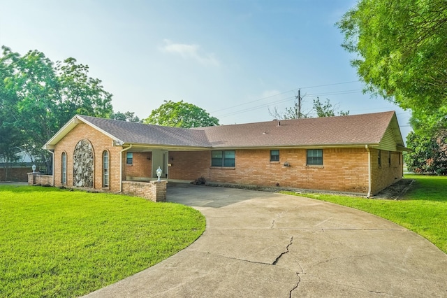 ranch-style house with a front yard