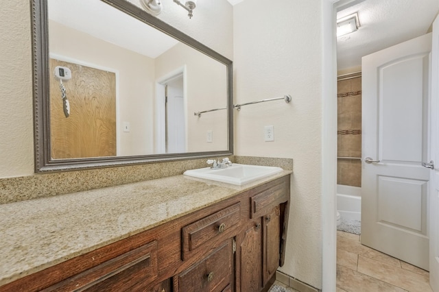 bathroom with vanity, tub / shower combination, and tile flooring