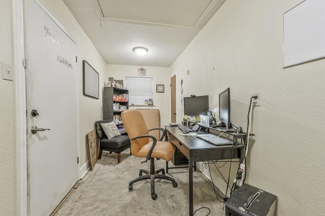 office area featuring concrete flooring