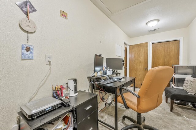 home office featuring concrete floors