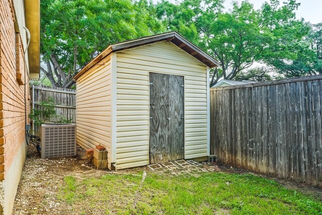 view of outdoor structure featuring central air condition unit