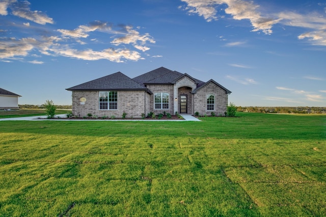 4201 Old Springtown Rd, Weatherford, TX 76085 - french country style house with a front lawn, brick siding, and a shingled roof