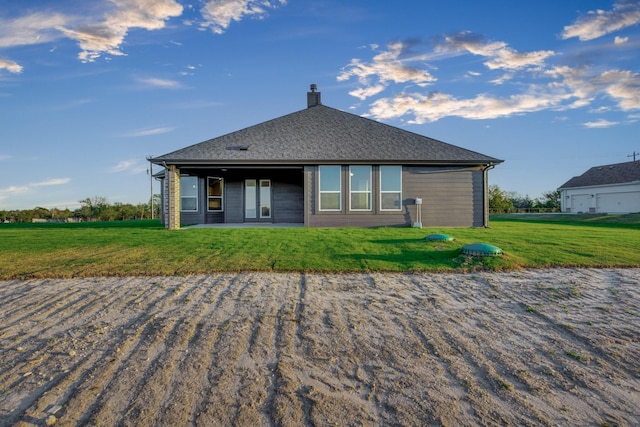 4201 Old Springtown Rd, Weatherford, TX 76085 - back of house with a chimney, a yard, and roof with shingles
