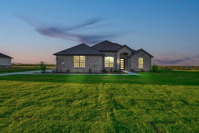 4201 Old Springtown Rd, Weatherford, TX 76085 - french country style house featuring a front lawn, brick siding, and roof with shingles