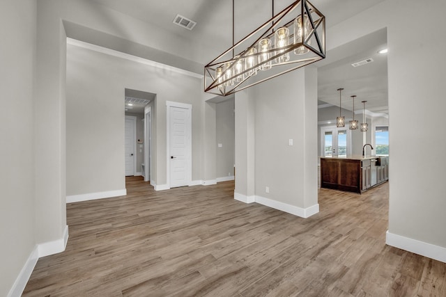 4201 Old Springtown Rd, Weatherford, TX 76085 - unfurnished dining area with baseboards and light wood-style floors