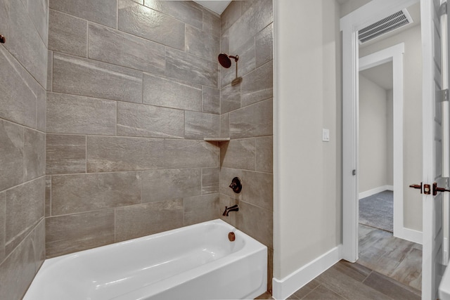 4201 Old Springtown Rd, Weatherford, TX 76085 - full bathroom with baseboards,  shower combination, and wood finished floors