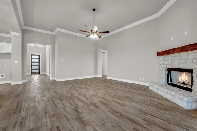 4201 Old Springtown Rd, Weatherford, TX 76085 - unfurnished living room with a fireplace, wood finished floors, a ceiling fan, crown molding, and baseboards