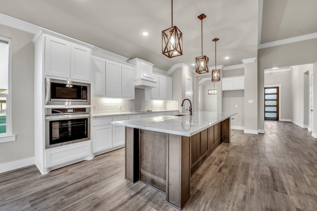 4201 Old Springtown Rd, Weatherford, TX 76085 - kitchen with appliances with stainless steel finishes, crown molding, tasteful backsplash, light wood finished floors, and white cabinets