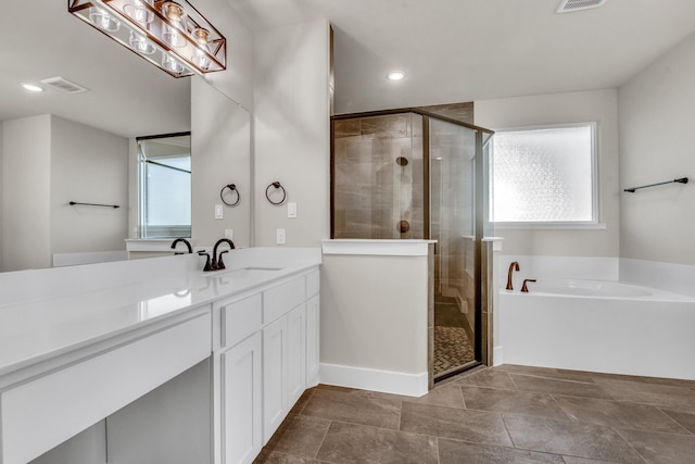 4201 Old Springtown Rd, Weatherford, TX 76085 - bathroom with healthy amount of natural light, a shower stall, vanity, a garden tub, and recessed lighting