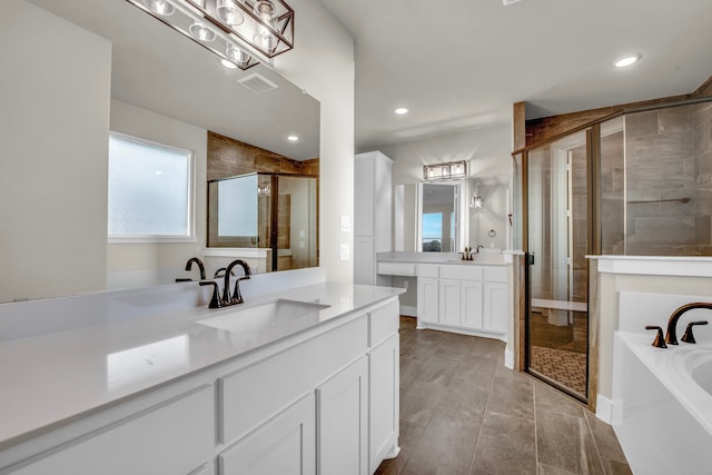 bathroom featuring vanity and plus walk in shower