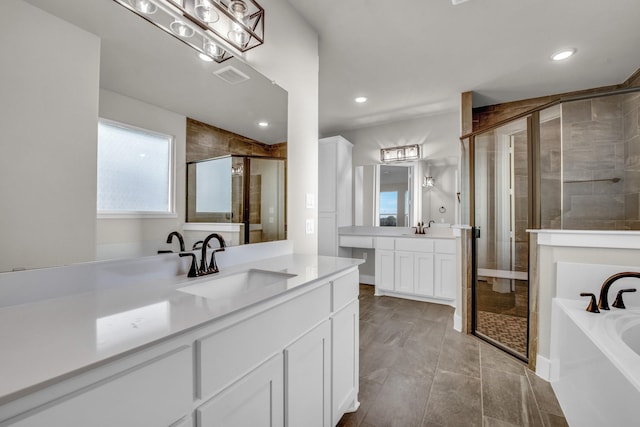 4201 Old Springtown Rd, Weatherford, TX 76085 - full bath with a shower stall, a bath, recessed lighting, and two vanities