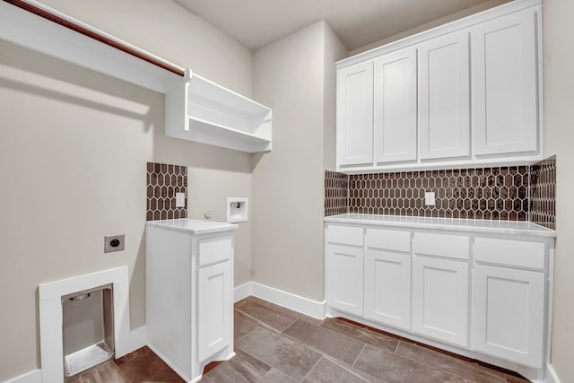 washroom with cabinets, washer hookup, and electric dryer hookup