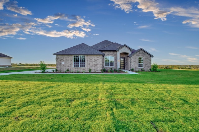 4201 Old Springtown Rd, Weatherford, TX 76085 - french country style house featuring a front yard, brick siding, and roof with shingles