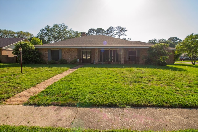 ranch-style home with a front yard