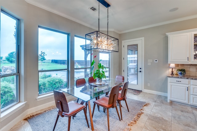 dining room with light tile patterned floors, baseboards, visible vents, and crown molding