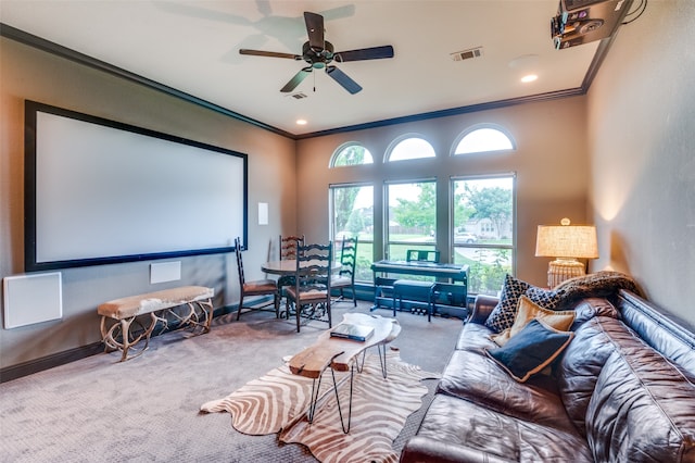 carpeted cinema featuring crown molding, recessed lighting, visible vents, a ceiling fan, and baseboards