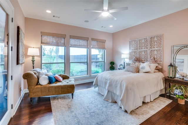 bedroom with visible vents, ornamental molding, and wood finished floors