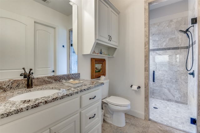 full bath featuring visible vents, baseboards, toilet, vanity, and a shower stall