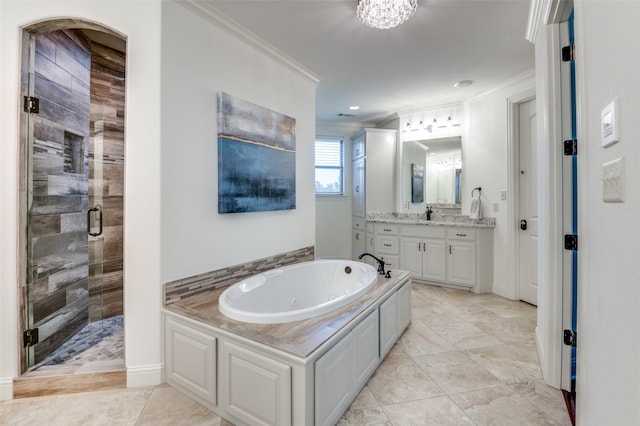 full bath featuring a stall shower, baseboards, a whirlpool tub, crown molding, and vanity