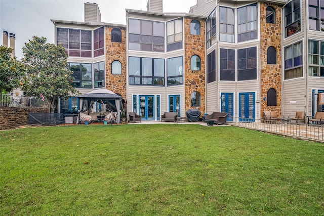 exterior space featuring a patio area, a gazebo, and a yard