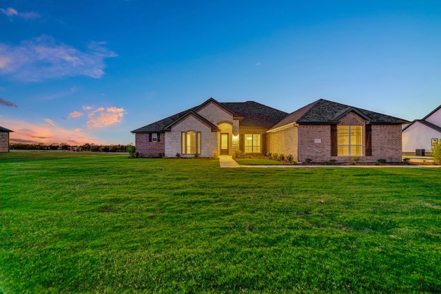 view of front of home with a lawn