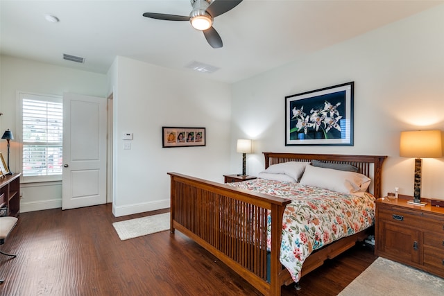 bedroom with ceiling fan and dark wood-type flooring