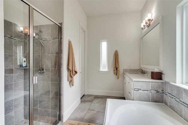 bathroom with vanity, separate shower and tub, and tile flooring