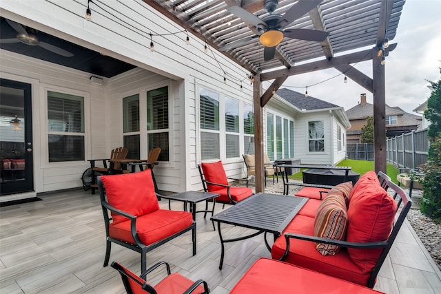 wooden deck featuring ceiling fan, a pergola, and outdoor lounge area