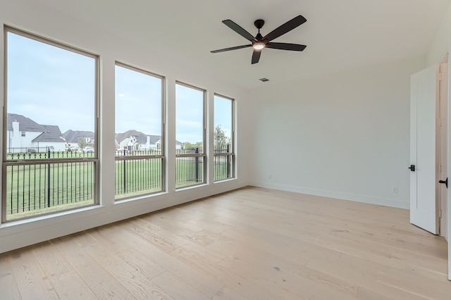 unfurnished room featuring ceiling fan and light hardwood / wood-style floors