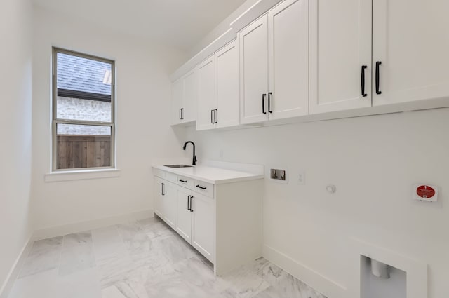 laundry area with washer hookup, gas dryer hookup, cabinets, and sink