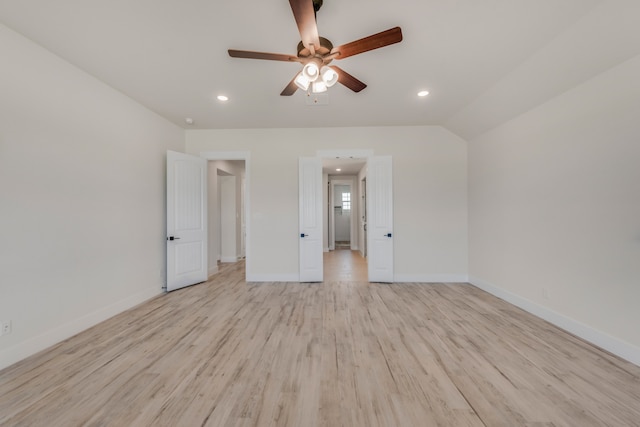 unfurnished bedroom with light wood-type flooring, lofted ceiling, and ceiling fan