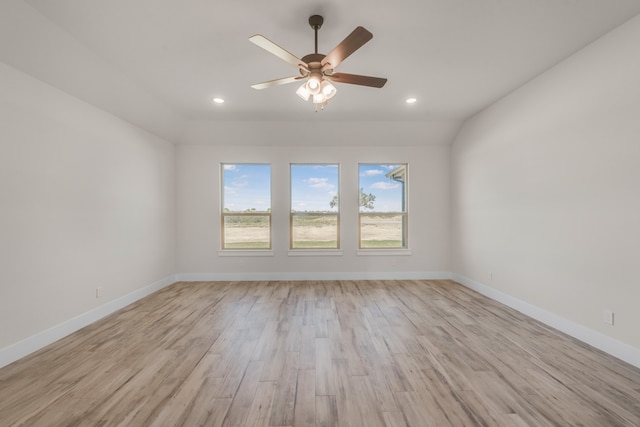 spare room with ceiling fan and light hardwood / wood-style floors