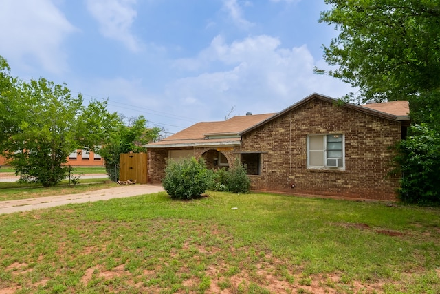 ranch-style home with a front yard