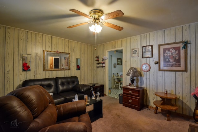 living room featuring carpet floors and ceiling fan